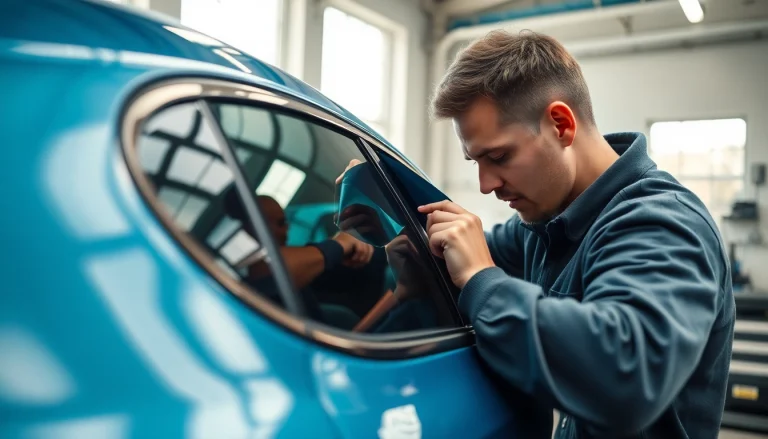 Experience exceptional window tinting Cleveland TN with our skilled technician applying film on a modern vehicle.